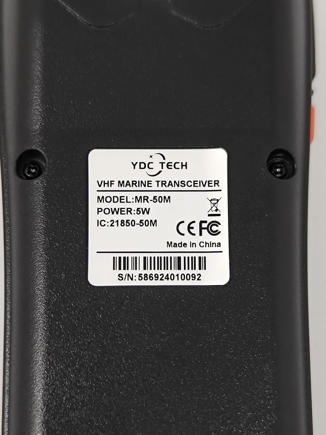 Close-up of the back label of the YDC TECH MR-50M marine radio showing model number and serial number