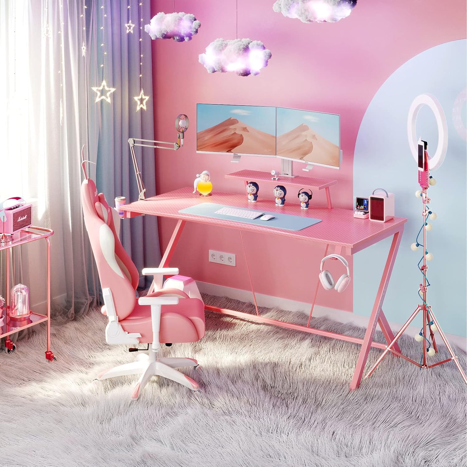 ภาพระยะใกล้ view of the MOTPK Pink Gaming Desk showing a monitor placed on the monitor shelf, with a keyboard and mouse on the main desktop.