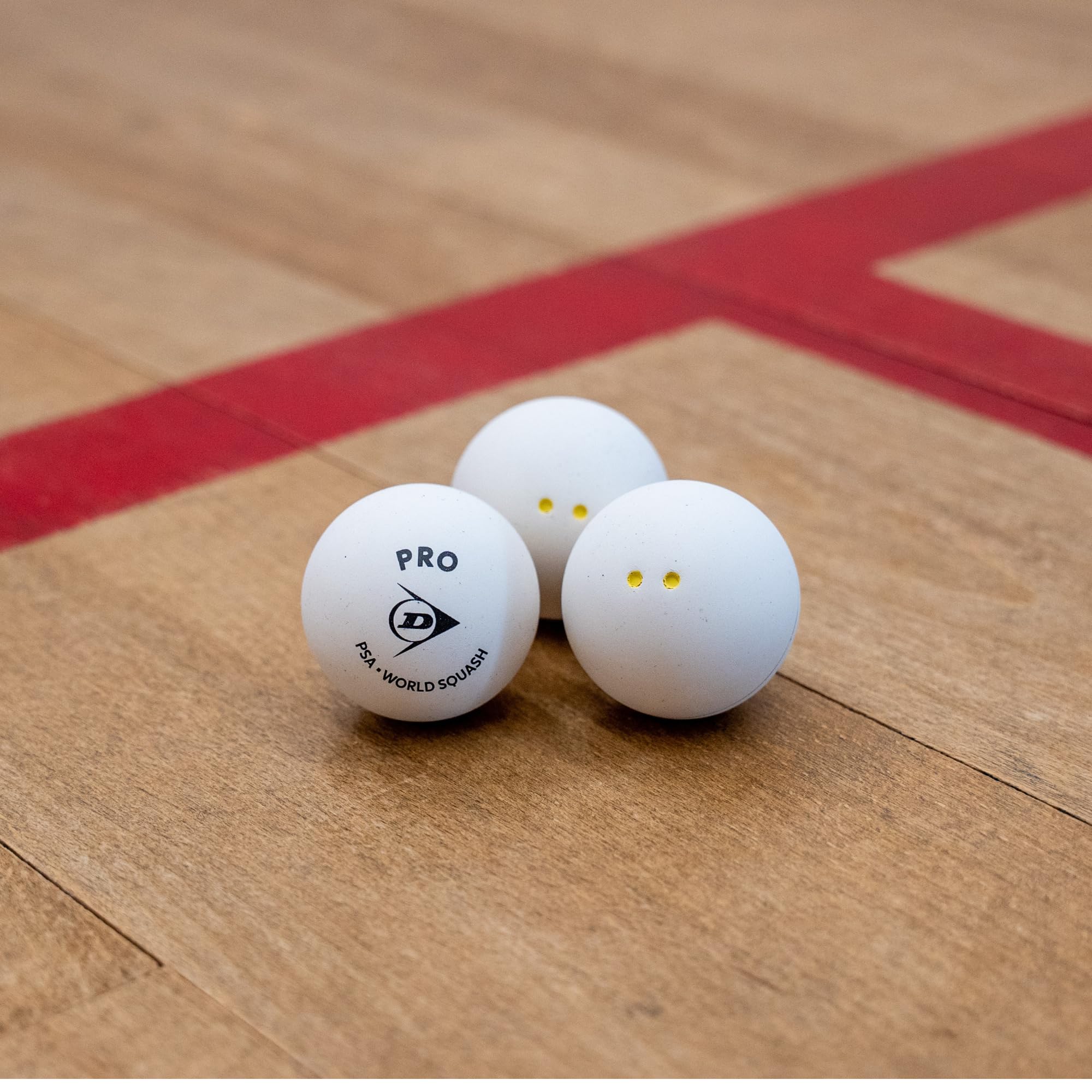 Dunlop Squashbälle Pro White, 2 gelbe Punkte, 12 Bälle