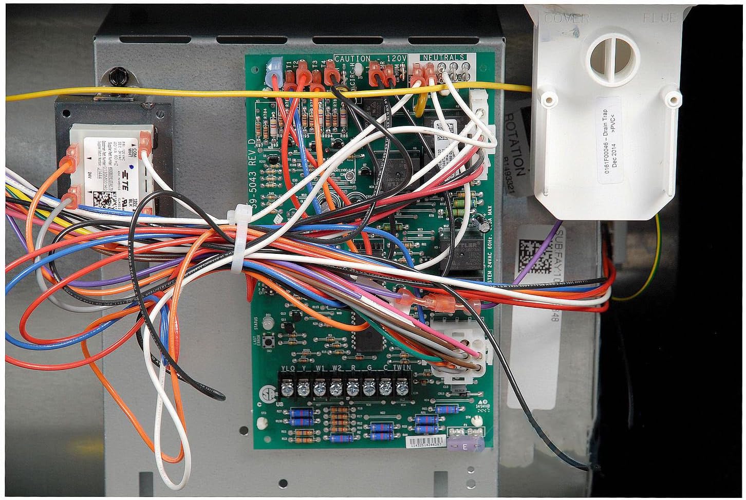 Close-up of the Goodman furnace's control board with various wire connections.