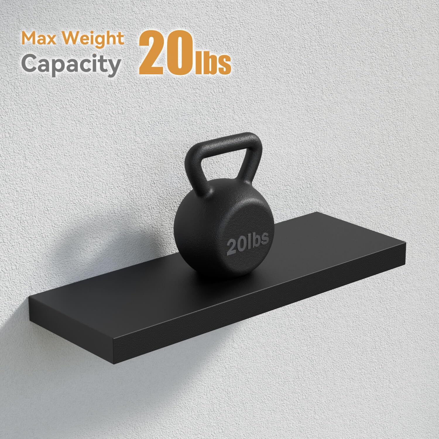 A single black floating shelf mounted on a white wall, with a 20-pound kettlebell placed on it, demonstrating its weight capacity.