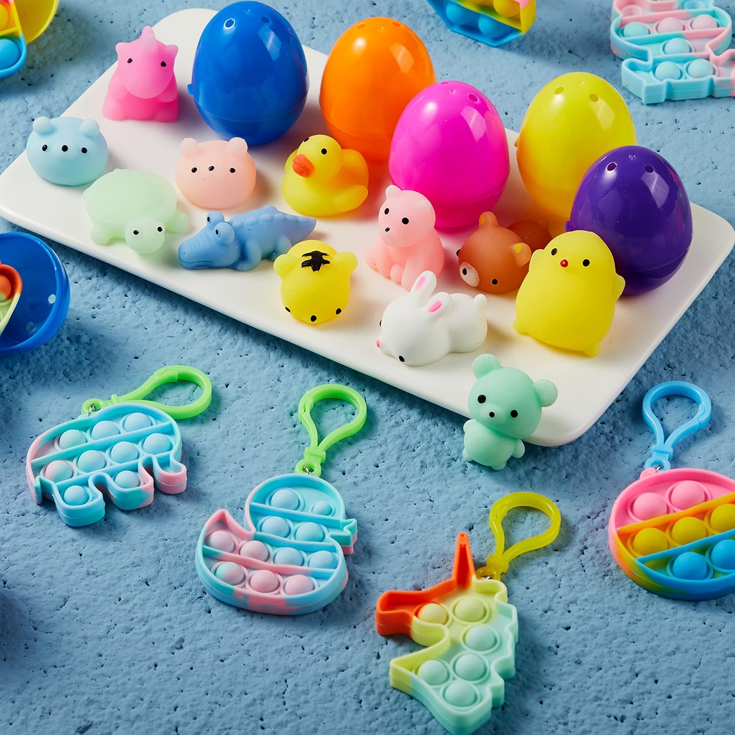 JOYIN 24 PCS Prefilled Easter Eggs with Assorted Toys,Filled with Mochi Squishy Toys and Pop Bubble Fidget Keychains,Stress Reliever Toys for Easter Basket Stuffers, Party Favors, Easter Egg Hunt - Image 6