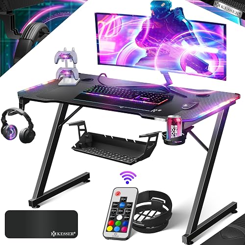KESSER® Mesa Gaming | 100 x 60 cm | Incl. LED | Escritorio para Gamer en Forma de Z | Soporte para Auriculares | Mesa ergonómica para Ordenador | Incl. Alfombrilla de ratón y Soporte