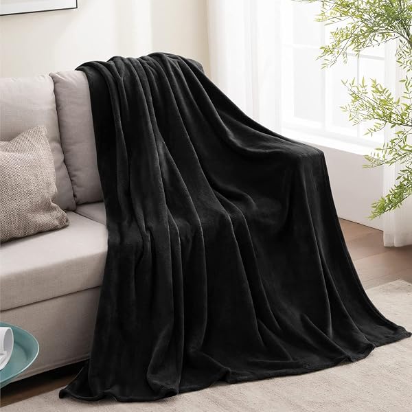 BEDELITE BEDELITE Fleece Blanket Black Throw Blankets for Couch & Bed, Luxury Plush Cozy Fuzzy Blanket, Super Soft Warm Lightweight Throw Blanket for Travel Camping Black Throw in use