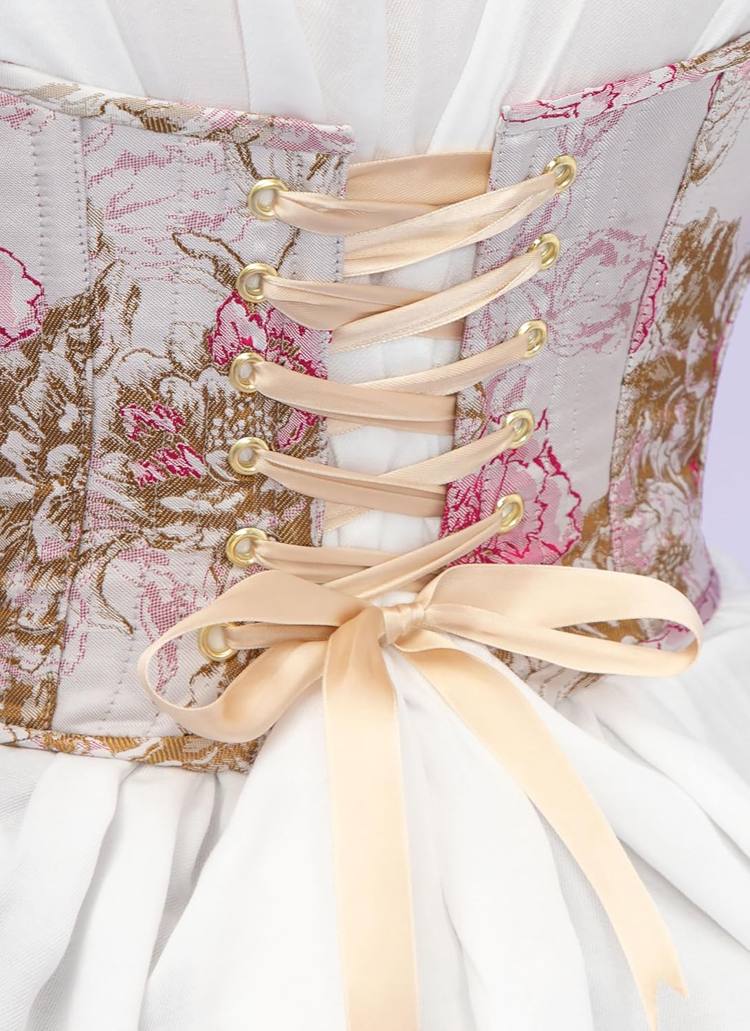 Close-up of corset back lacing with grommets and ribbon.