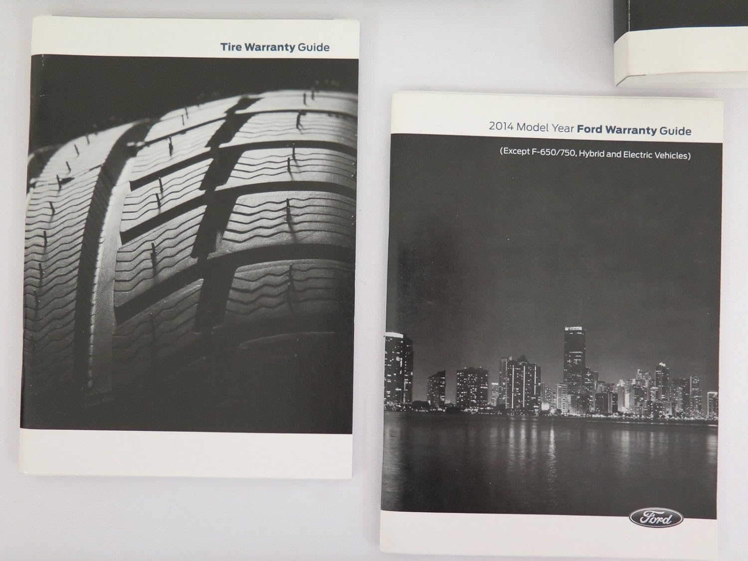 Collection of manuals and a black pouch for the Ford Focus