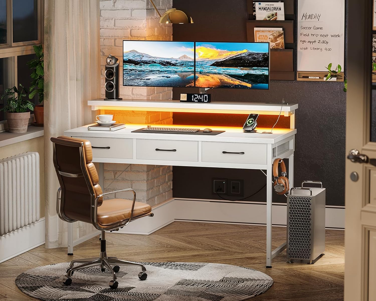 A white ODK desk used as a home office setup with a monitor, laptop, and office chair.