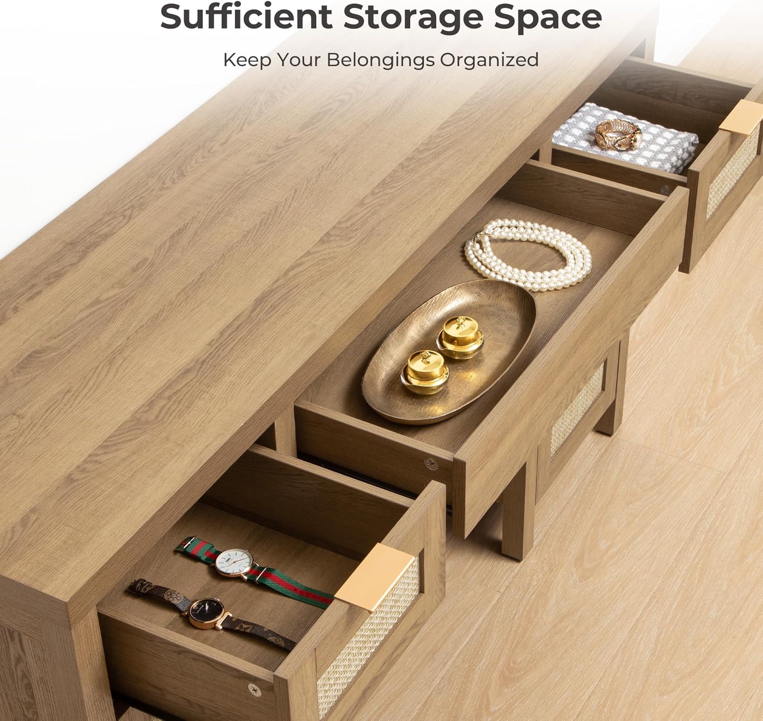 Overhead view of the desk with drawers open, showing various items like jewelry, watches, and folded clothes stored inside.