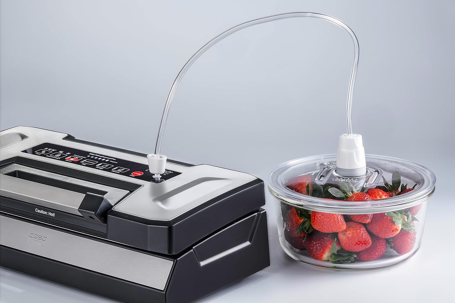CASO VRH 790 advanced Pro Vacuum Sealer connected via hose to an external vacuum container filled with strawberries