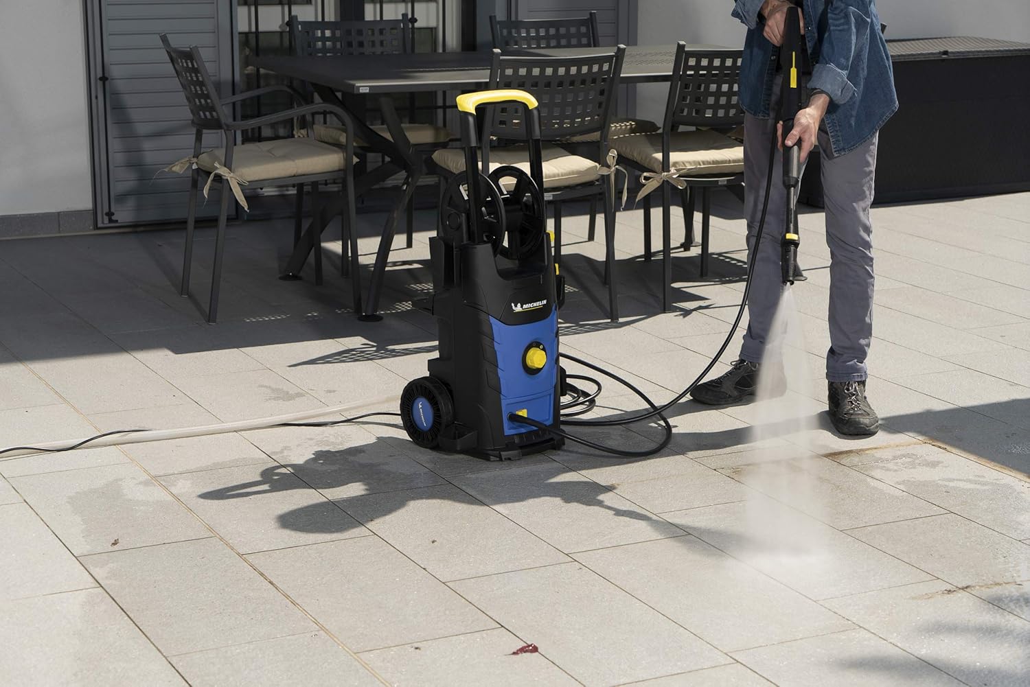 User operating Michelin MPX19EH High-Pressure Washer from a different angle
