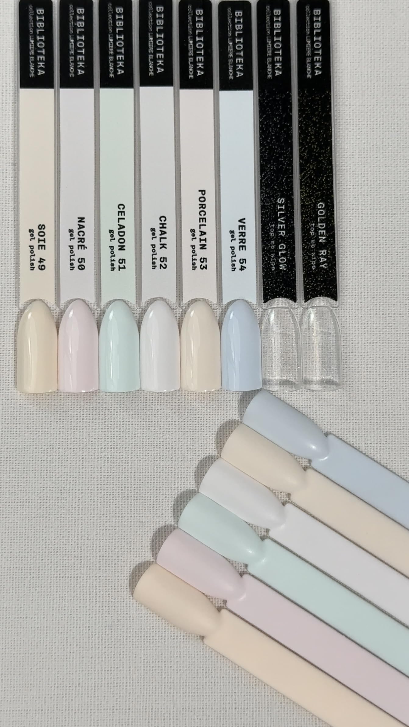 BIBLIOTEKA Colección LUMIÈRE BLANCHE Set Esmaltes Semipermanentes y tops coat shimmer. Fácil autonivelado, cobertura uniforme. 6 Tonos claros pasteles y 2 tops sin capa pegajosa, 8 uds de 10 ml.