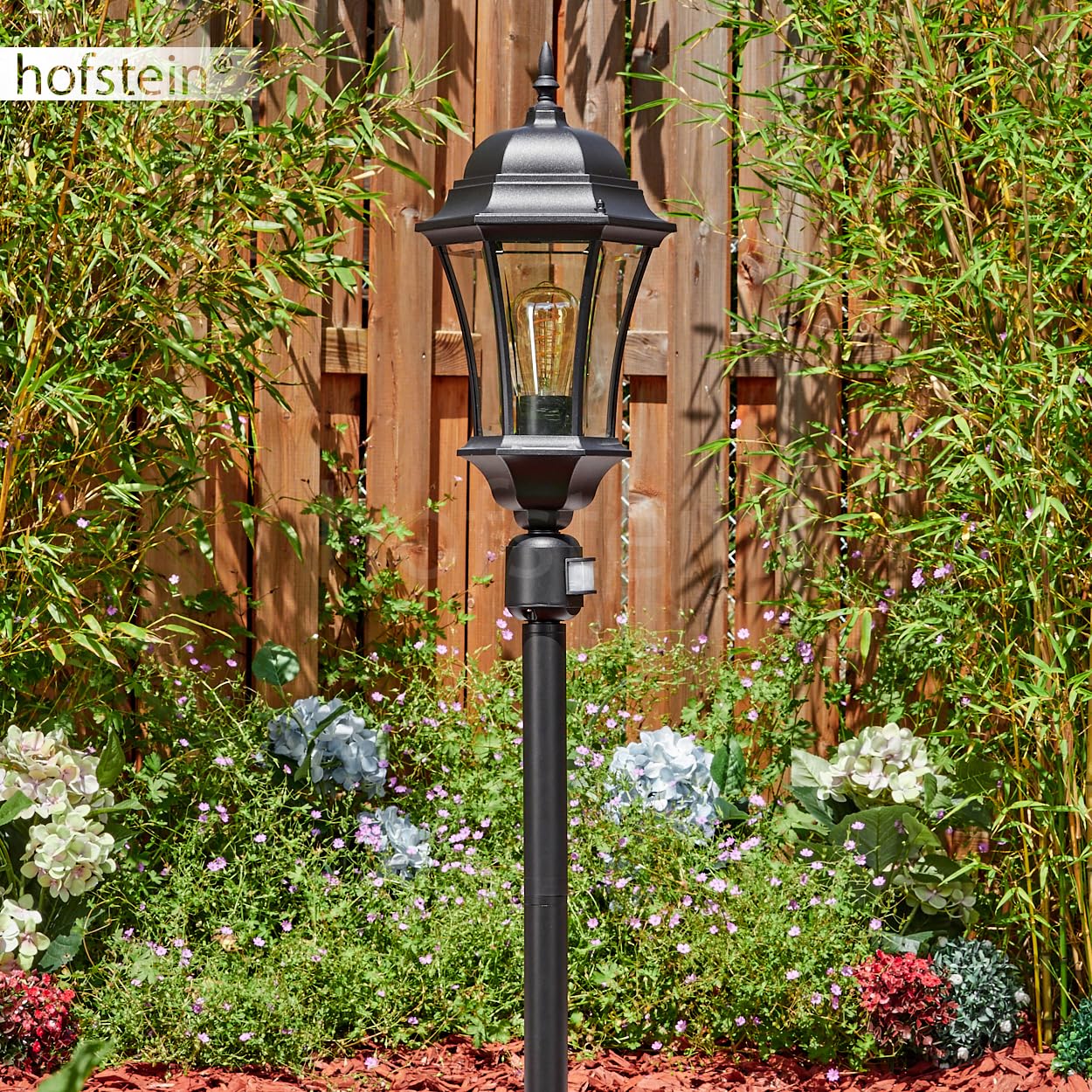 HOFSTEIN Etoe lampa drogowa zewnętrzna z czujnikiem ruchu z metalu/szkła w kolorze czarnym/przezroczystym, lampa zewnętrzna o wyglądzie antycznym, wysokość 116 cm, oświetlenie ogrodowe IP44, 1 x E27,