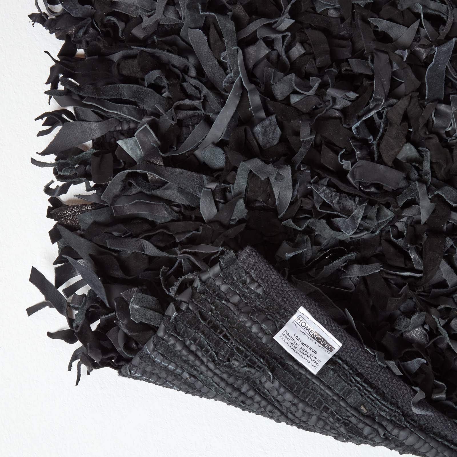 Homescapes Lederteppich Dallas 150 x 240 cm, Fransenteppich aus 100% Echtleder, moderner Shaggy-/Hochflor-Teppich, schwarz
