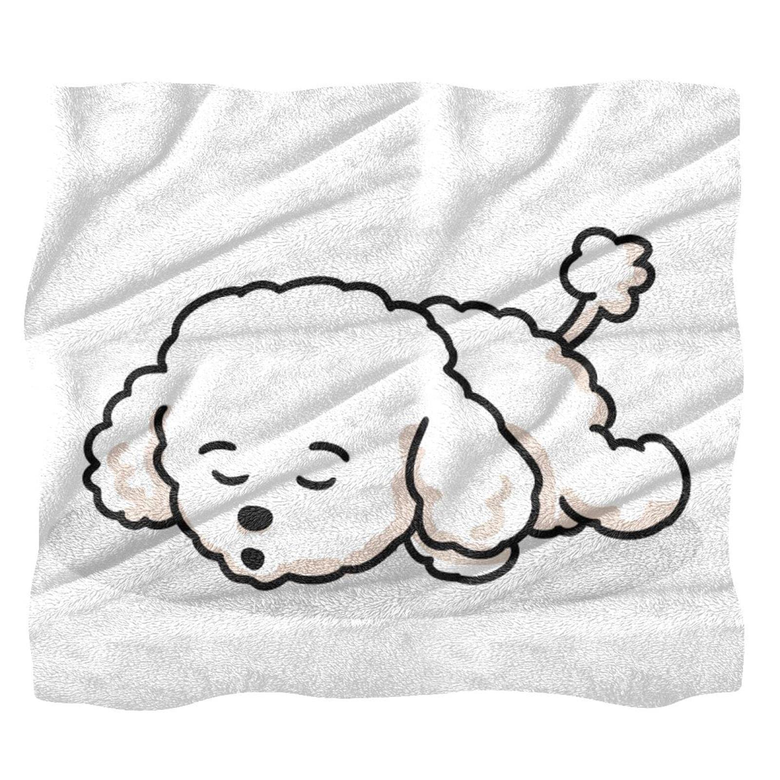 Couverture polaire caniche contre le froid sur le canapé