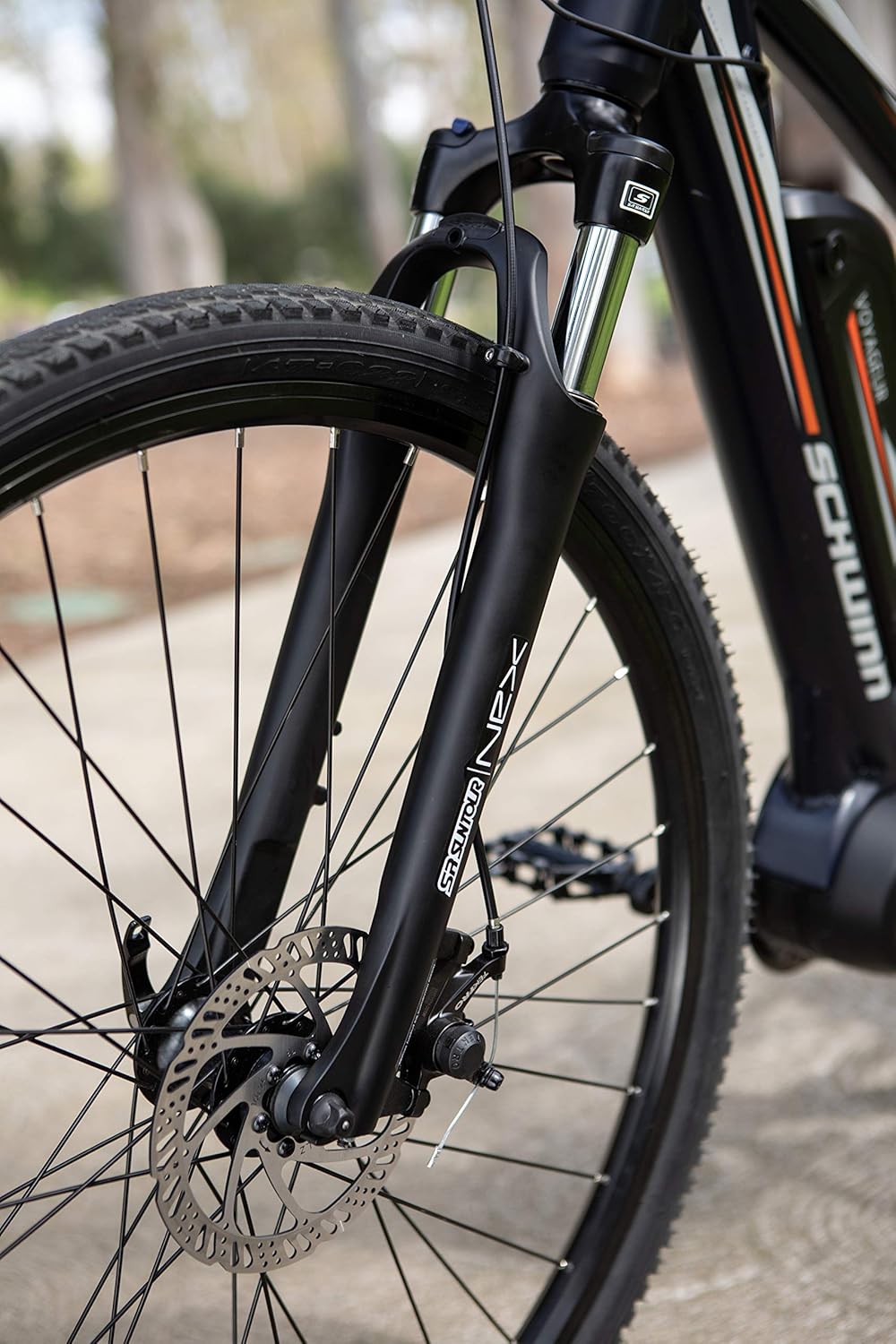 Close-up of the front suspension fork and mechanical disc brake on the Schwinn Voyageur