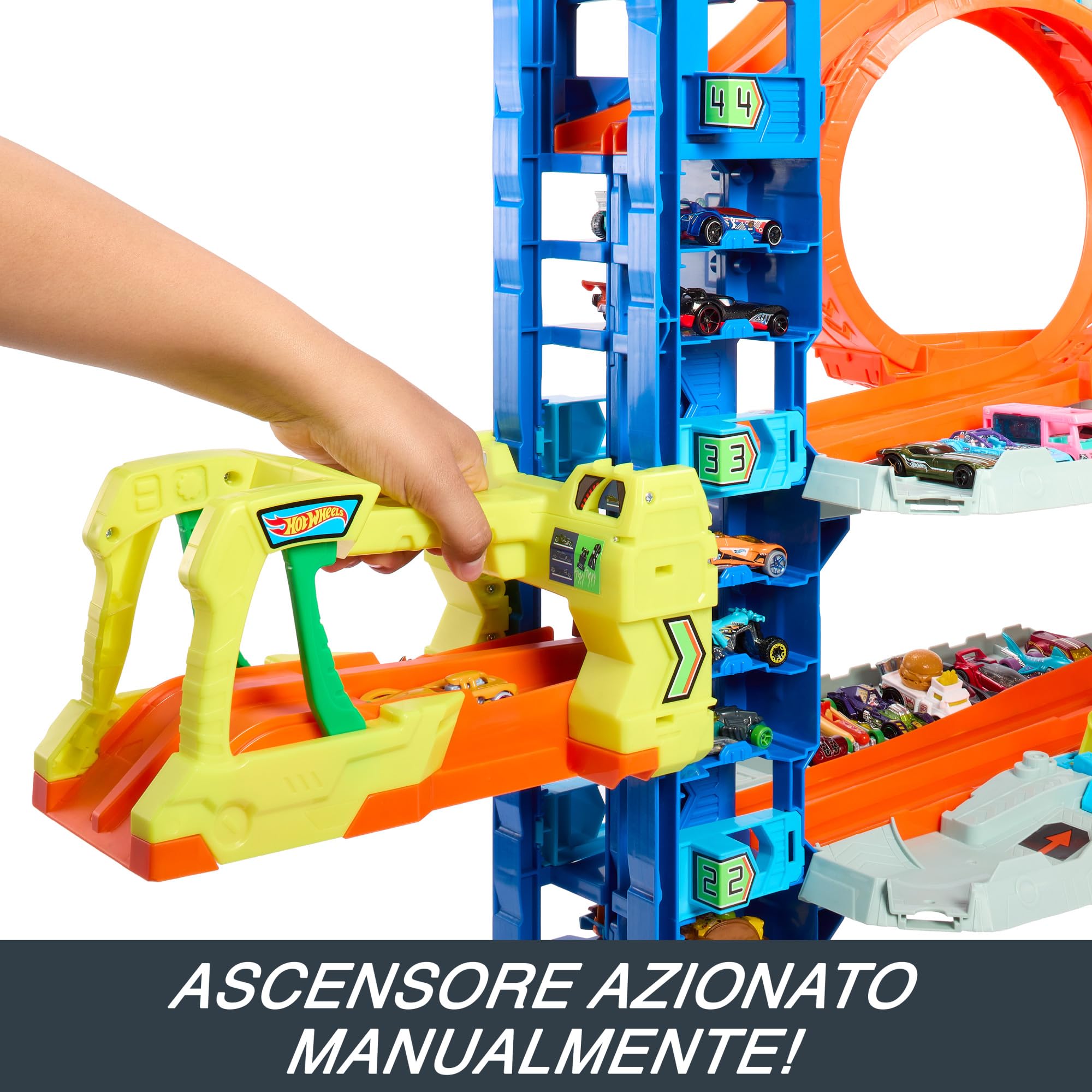 Hot Wheels City 'Let's Race' Netflix - Mega Garage, Playset con quattro livelli di gioco e drago divora auto, con 2 macchinine die-cast e box per riporre 50 veicoli in scala 1:64, 4+ anni, HKX48
