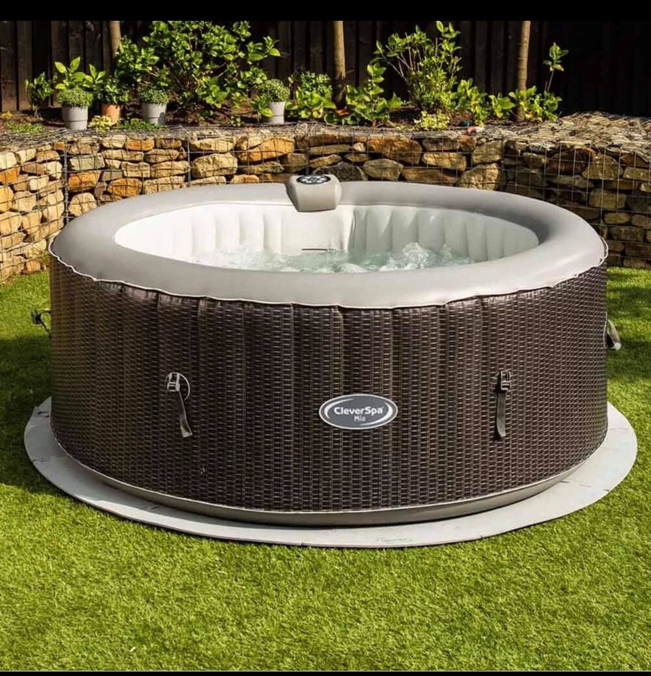 Contents of CleverSpa Mia Hot Tub box including hot tub, cover, filter, groundsheet, locking clips, and inflation hose.