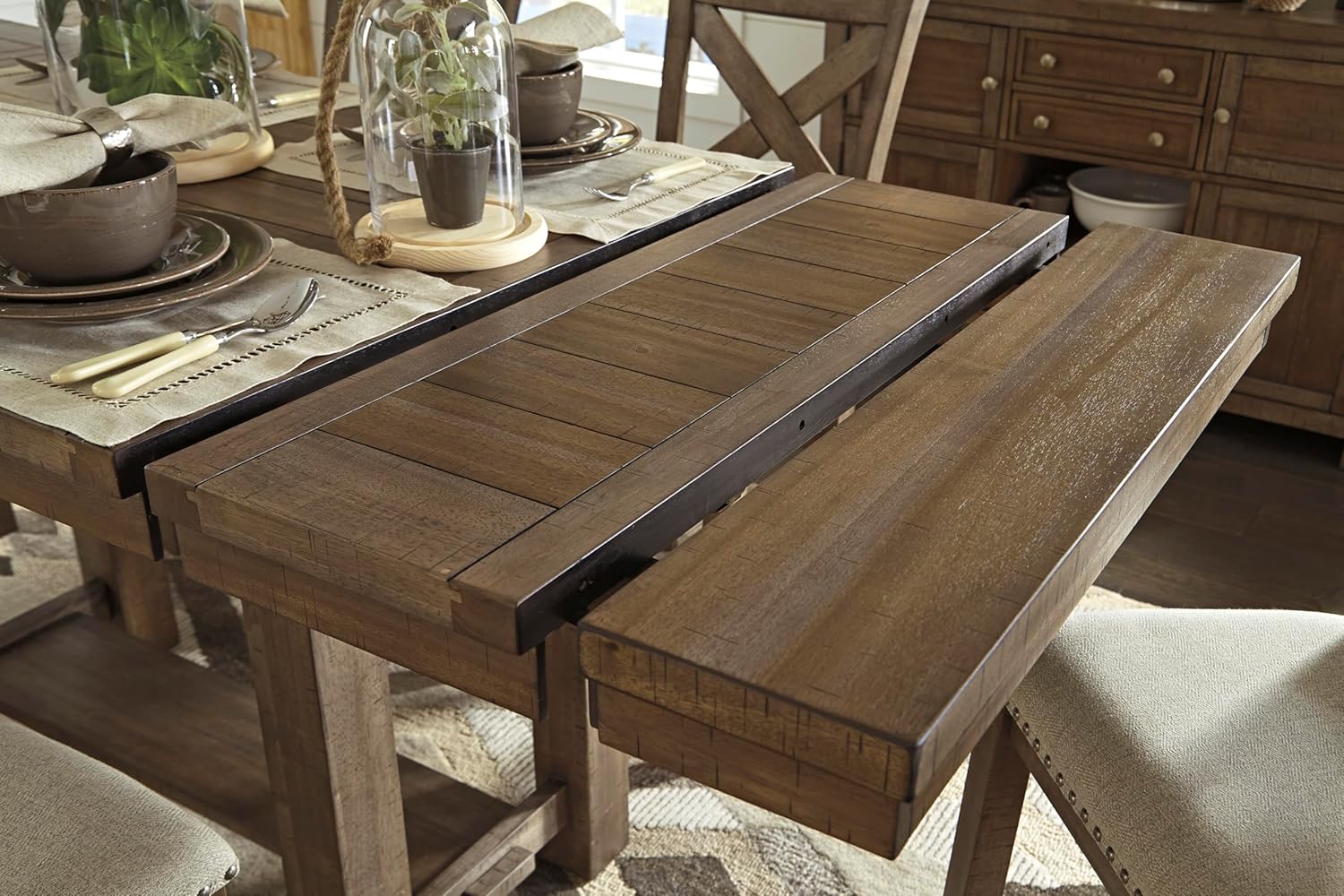 Close-up view of the table's extension leaf mechanism