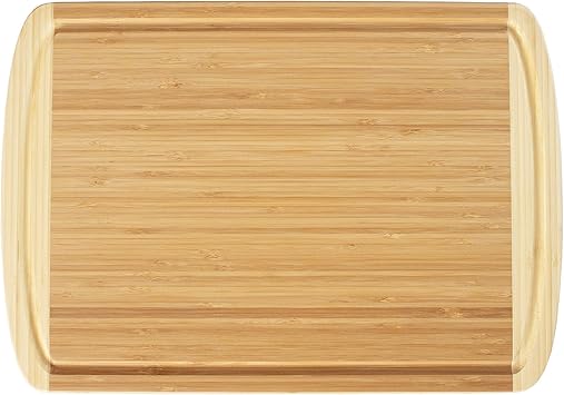 Totally Bamboo Kona Groove Bamboo Wood Cutting Board with sliced steak.
