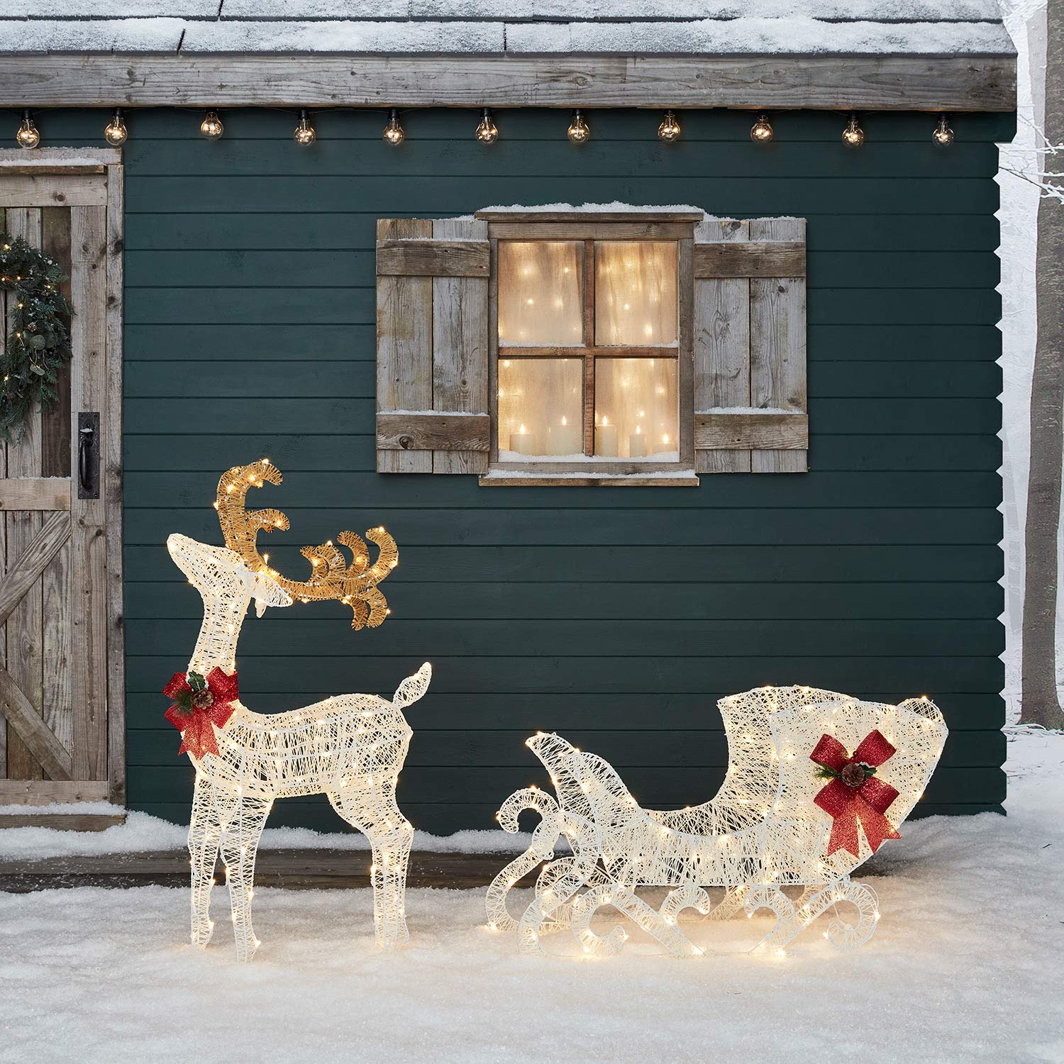 Lights4fun 280er LED Rentier mit Schlitten 100cm warmweiß Timer innen und außen