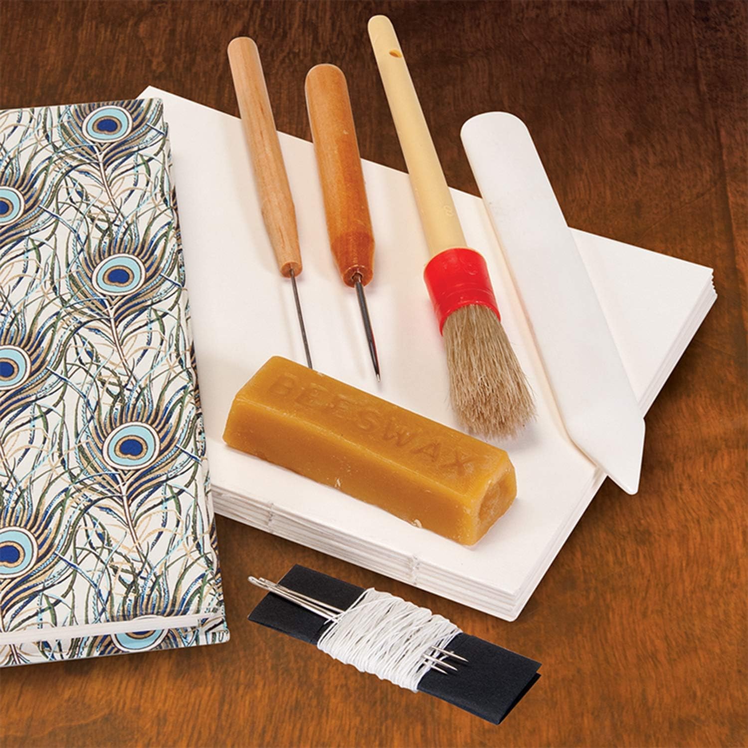 Lineco Bookbinding Tool Kit. Comes with Awls, Bone Folder, Bristle Brish, Needles, Linen Thread, and Beeswax.