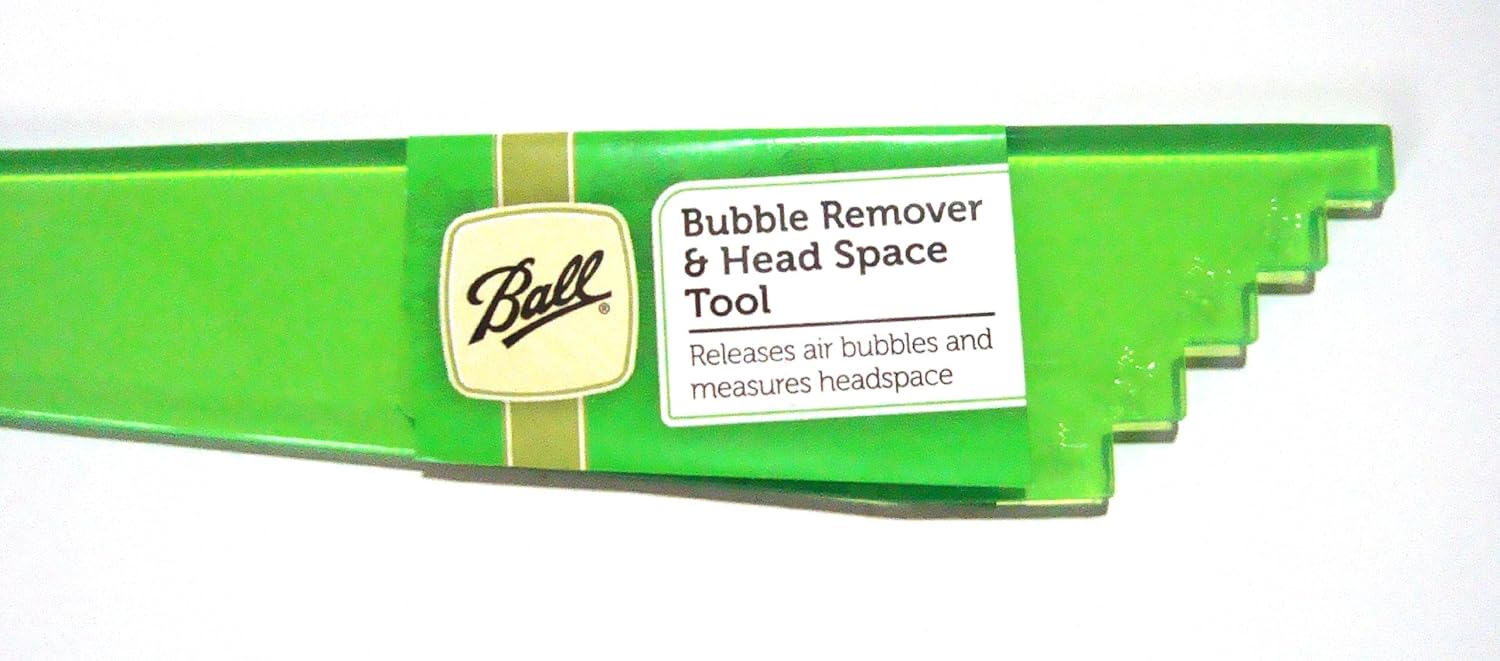 Close-up of the Ball Bubble Remover and Head Space Tool showing the stepped end for measurement