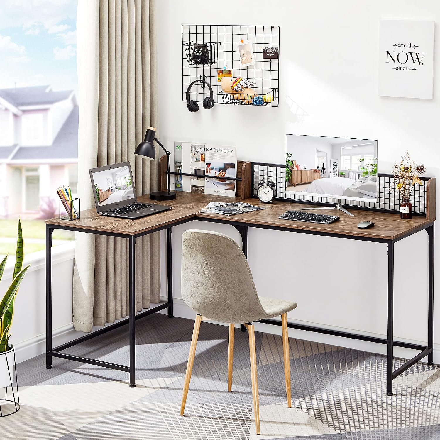 GreenForest L Shaped Desk set up in a bright room with a laptop, monitor, and office accessories, demonstrating its use as a computer desk.