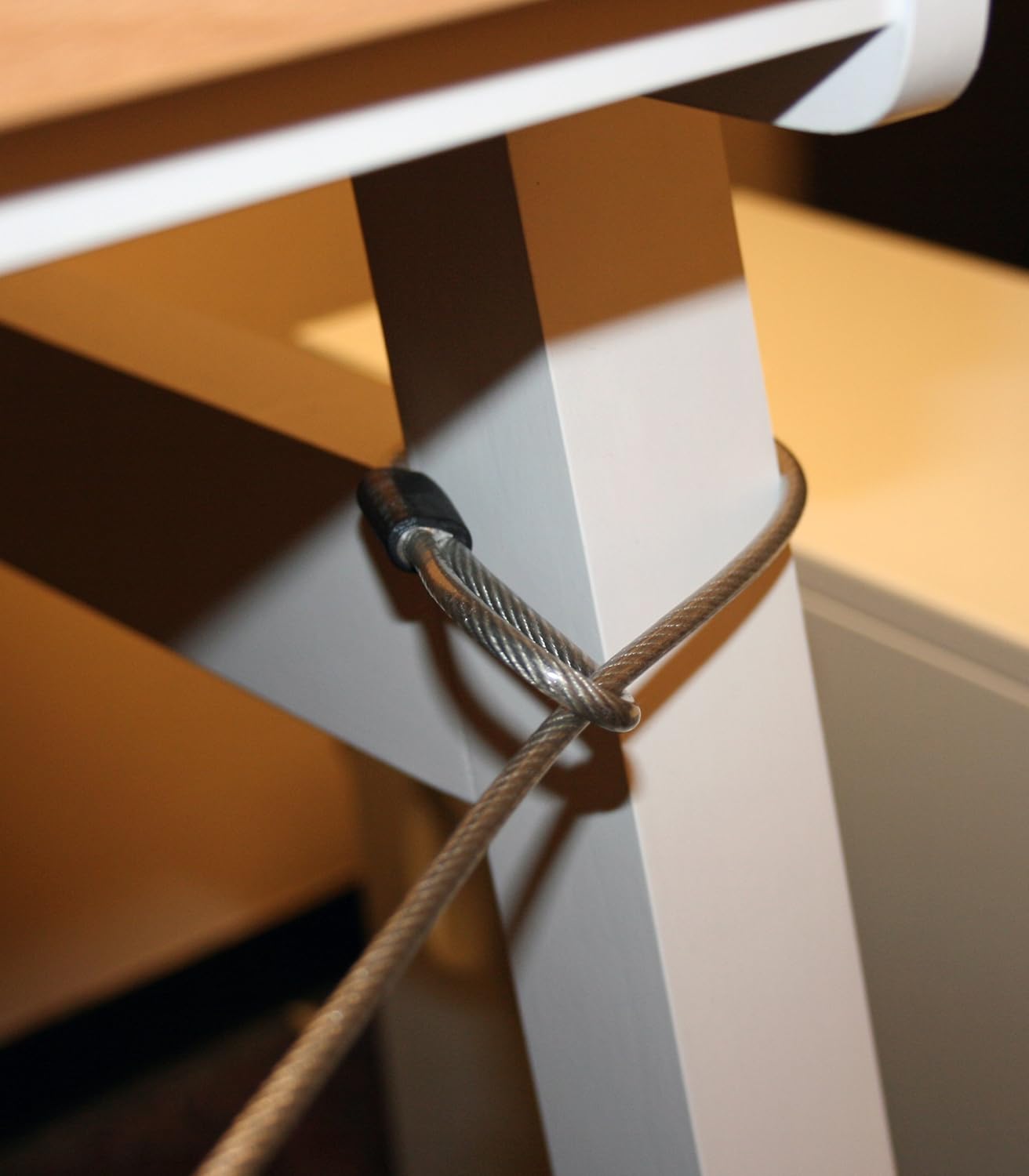 FJM Security SX-645 cable looped around a table leg