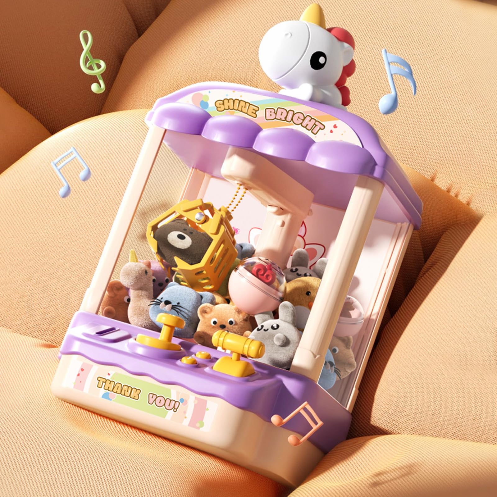 Belle machine à griffes avec son et jouet en peluche