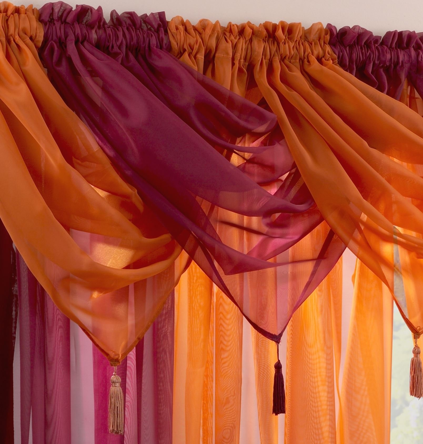 Supplied by Maple Textiles Luxury Voile Tasselled Swag in Maroon