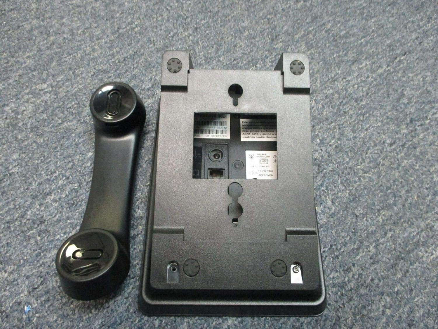 Back view of the Avaya 1603-I IP Phone with handset and stand