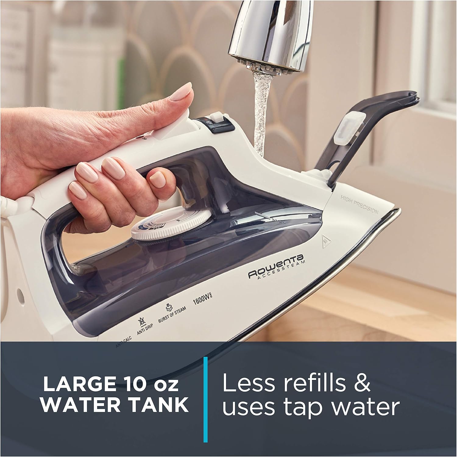 Hand filling the Rowenta DW2171 iron's water tank under a faucet.