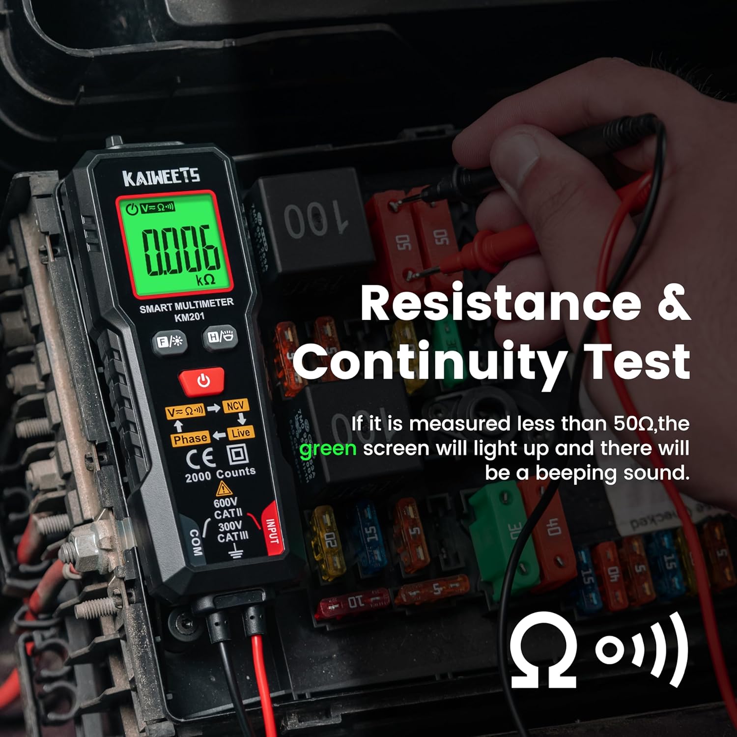KAIWEETS KM201 performing a resistance and continuity test on a fuse box