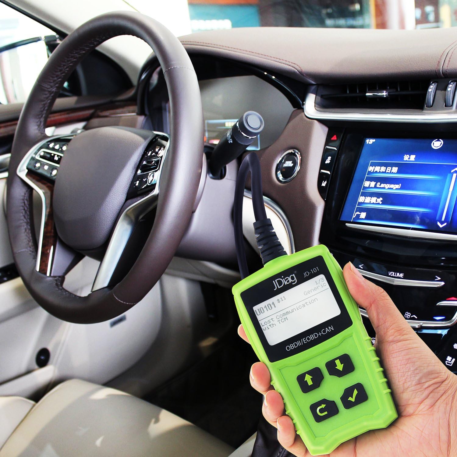 JDIAG JD101 scanner connected to a vehicle's OBD-II port, displaying information on its screen.