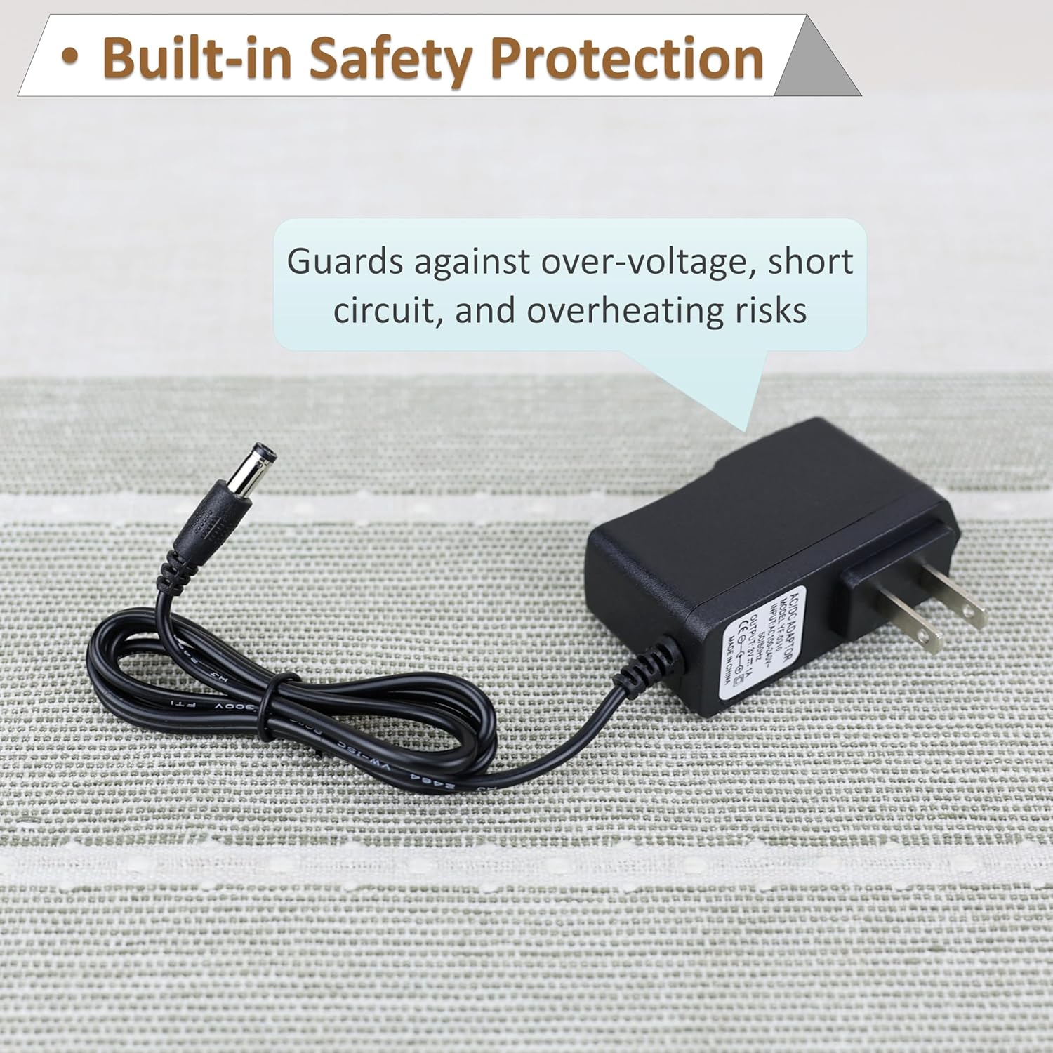 Image showing the power adapter with text indicating it guards against over-voltage, short circuit, and overheating risks.