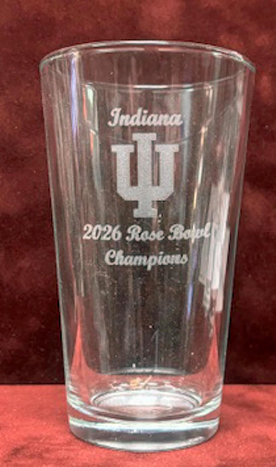 Set of 4 Indiana Hoosiers 2025-2026 Championship 16 oz pint glasses including 2026 National Champions, 2026 Peach Bowl Champions, 2026 Rose Bowl Champions, and 2025 Big 10 Champions