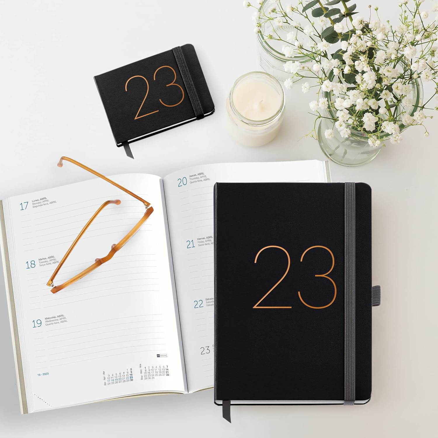 Miquelrius - 2023 Year Planner - Week to View - Plus Size 155 x 213 mm (Approx A5) - Stitched Leather Hard Cover - Elastic Rubber - Spanish, English and Portuguese - Black