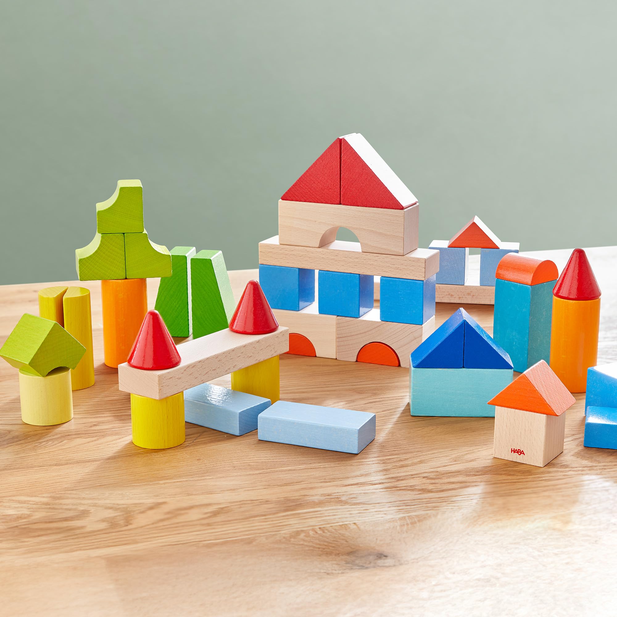 HABA Mis Primeros Bloques de construcción – 46 Bloques de Madera de Colores con Bolsa de algodón – Fabricado en Alemania – para niños a Partir de 1 año – Promueve la motricidad Fina – 2010877001