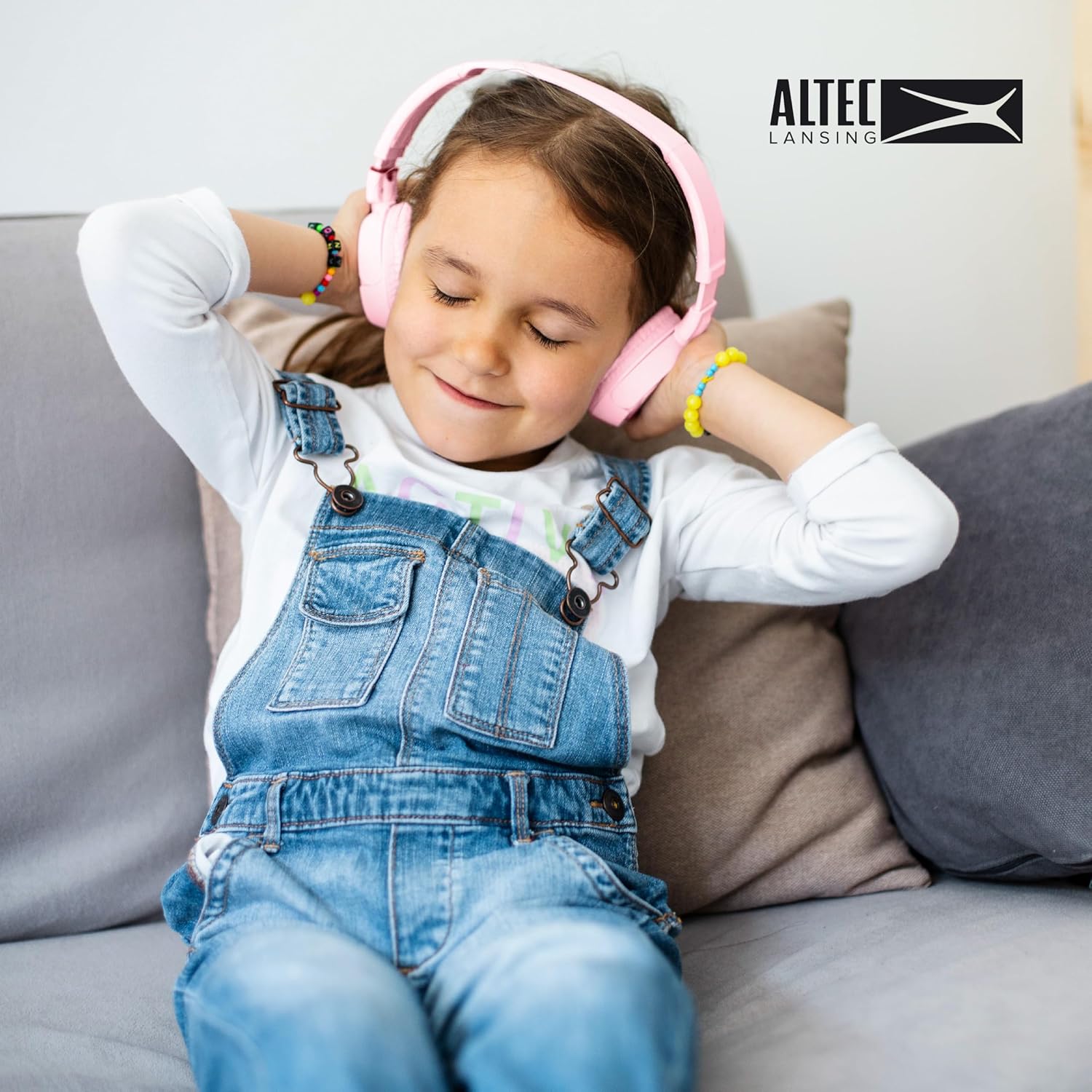 Child happily wearing Altec Lansing Kid Safe Headphones