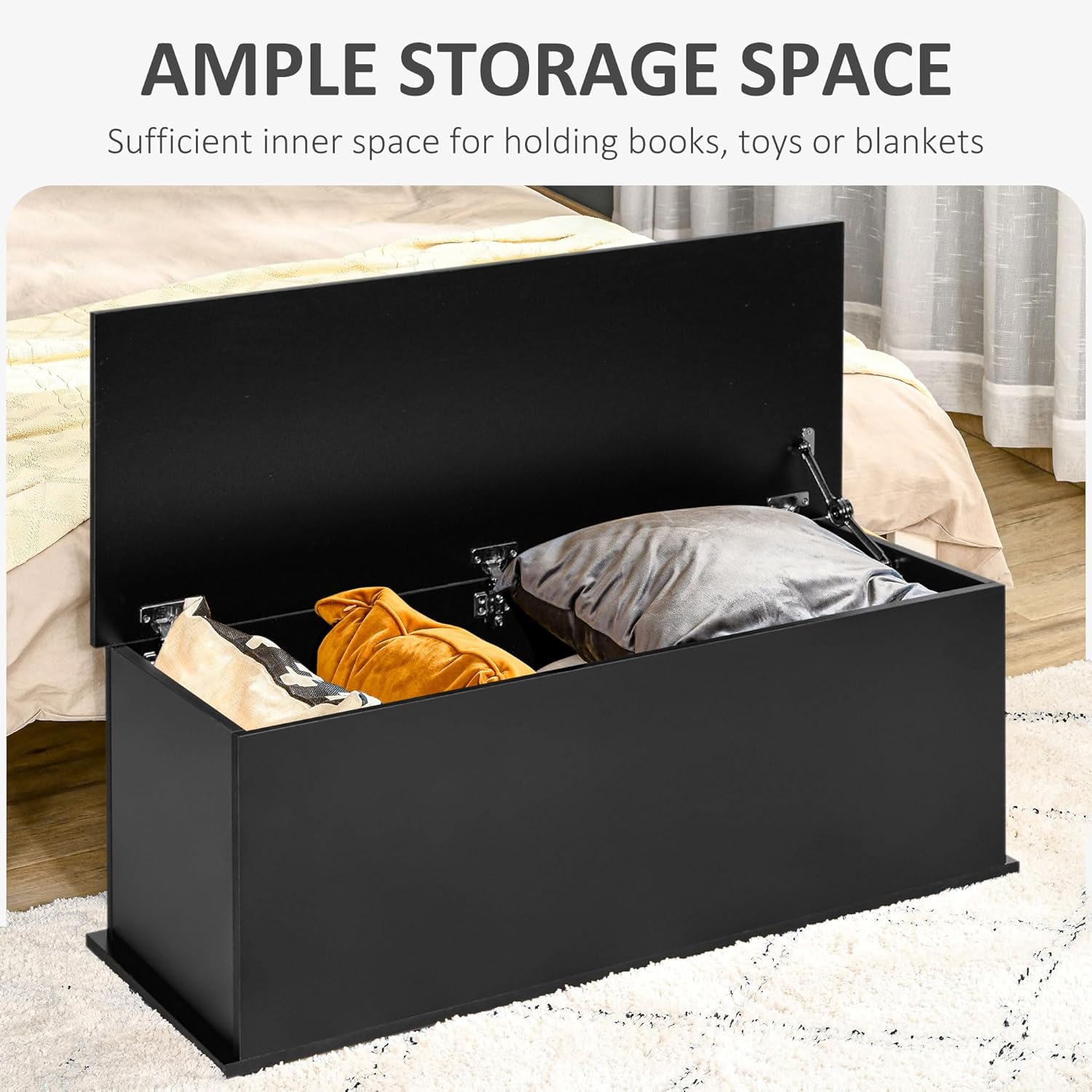 Storage chest with lid open, filled with blankets and pillows, illustrating ample storage space