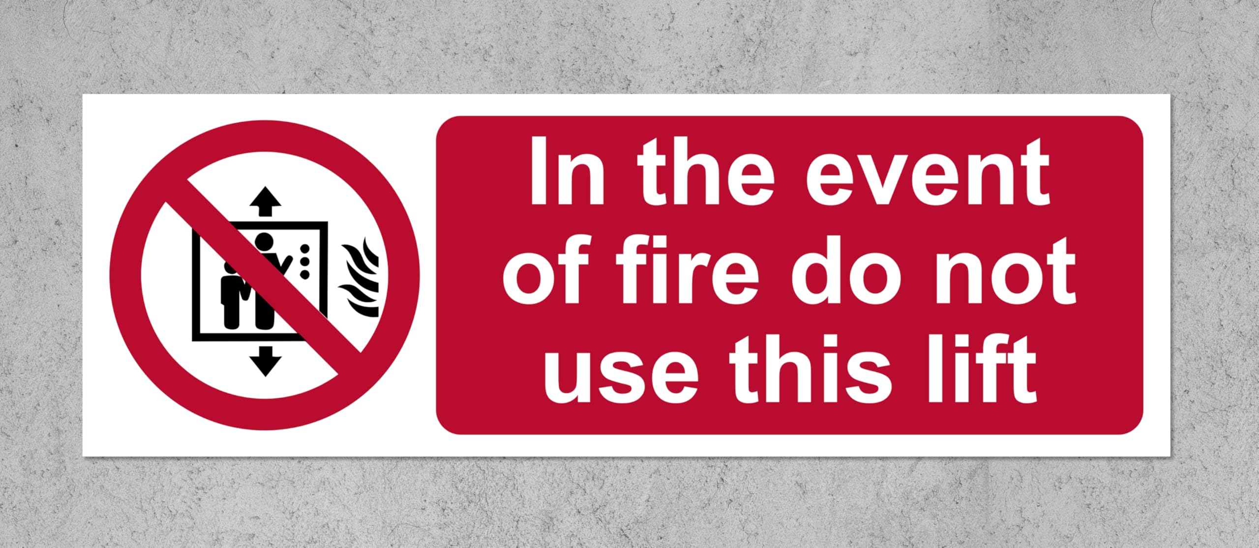 In the event of fire do not use this lift Safety sign - Self adhesive sticker 300mm x 100mm