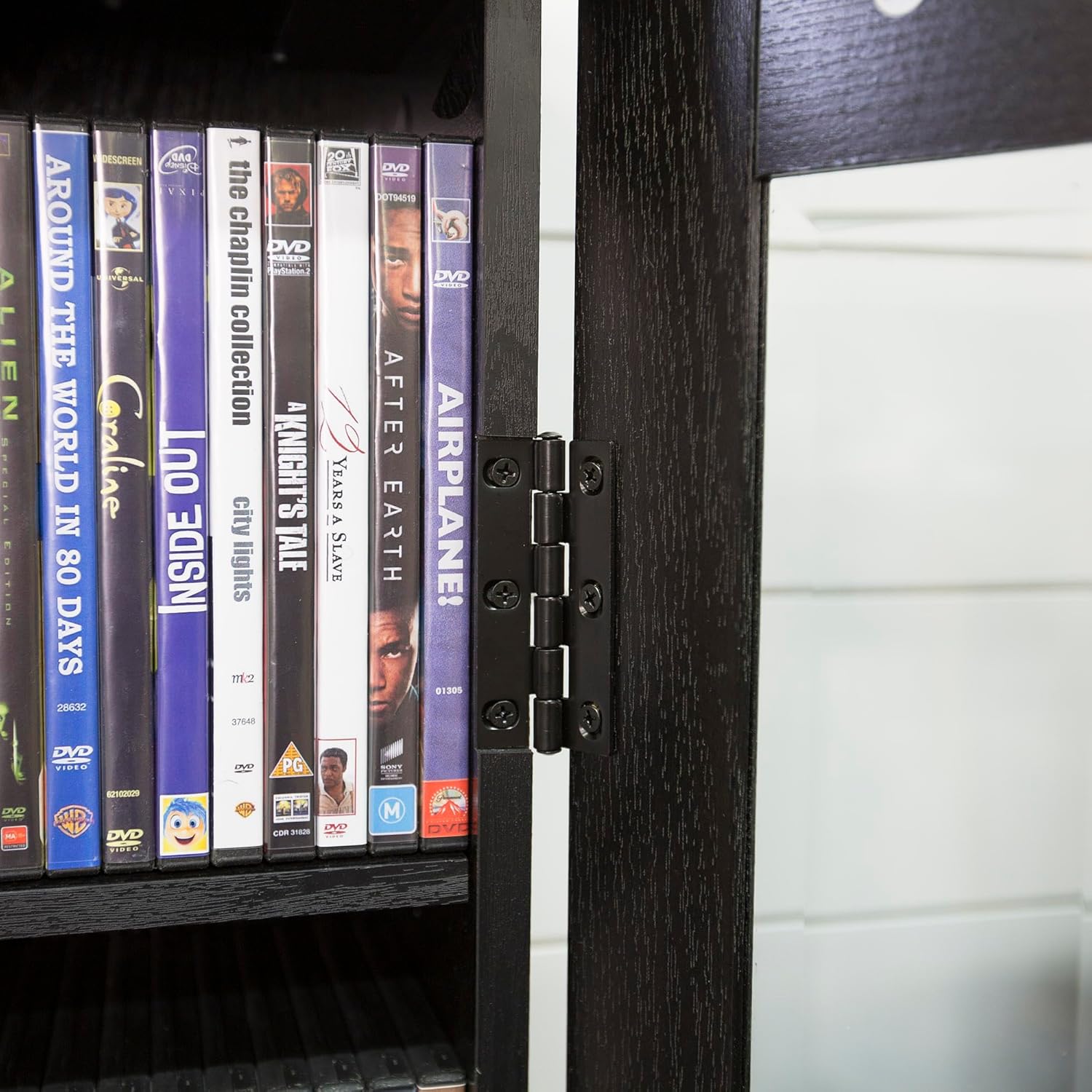 Close-up of the hinges on the Walker Edison 4-Tier Storage Cabinet doors