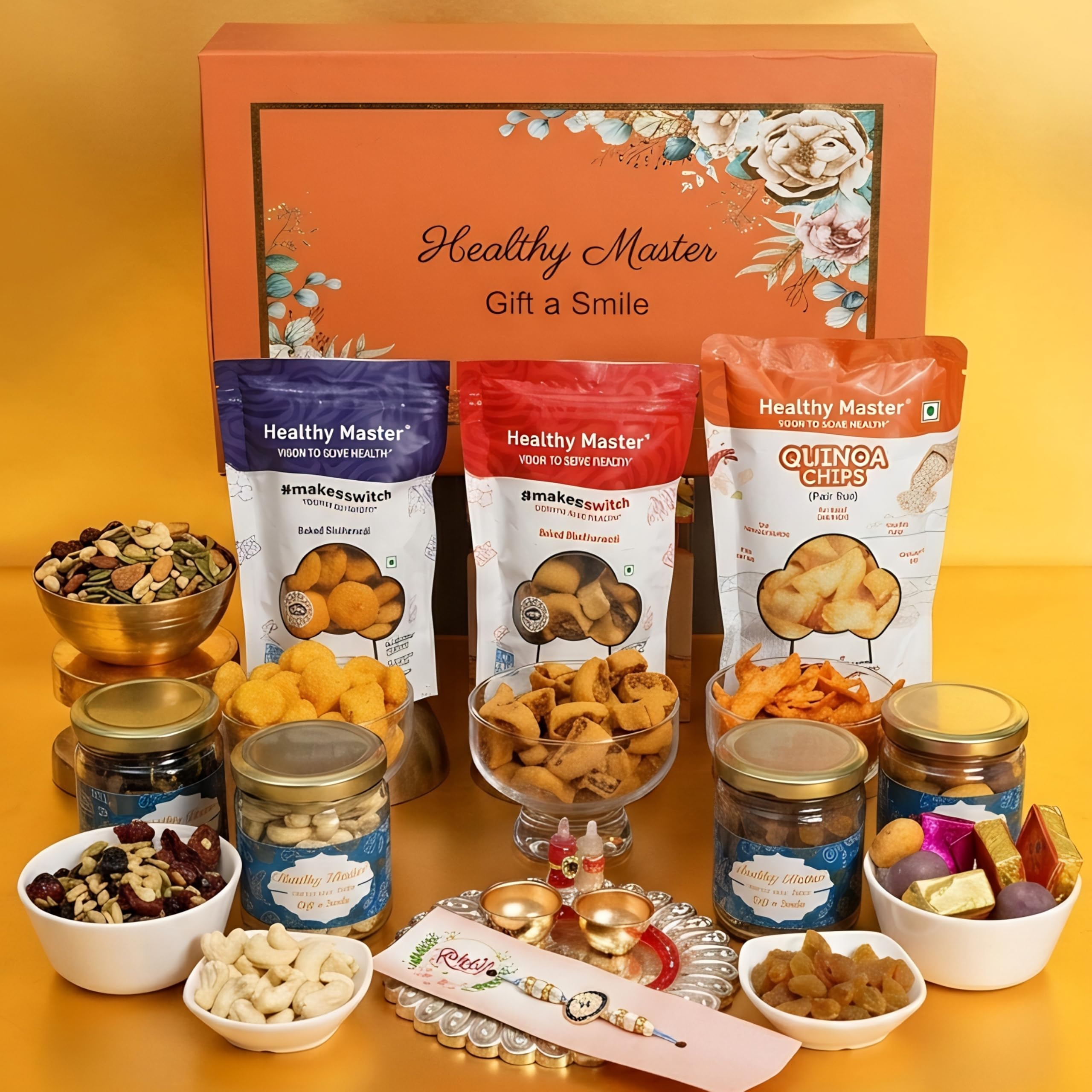 Healthy Master Everlasting Rakhi Box | Box of 11 Gift Hamper for Brother | Healthy Snacks, Chips, Millet Balls, Pudina Snacks, Bhakarwadi, Dry Fruits, Almond Chocolate, Jar, Drawing Book, Rakhi & Kumkum Chawal-image-46
