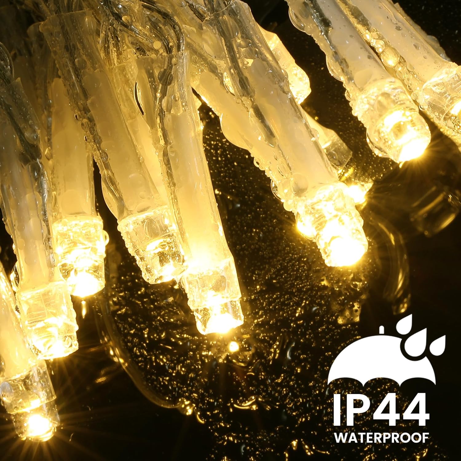 Close-up of Quntis LED icicle lights with water droplets, demonstrating their IP44 waterproof rating.