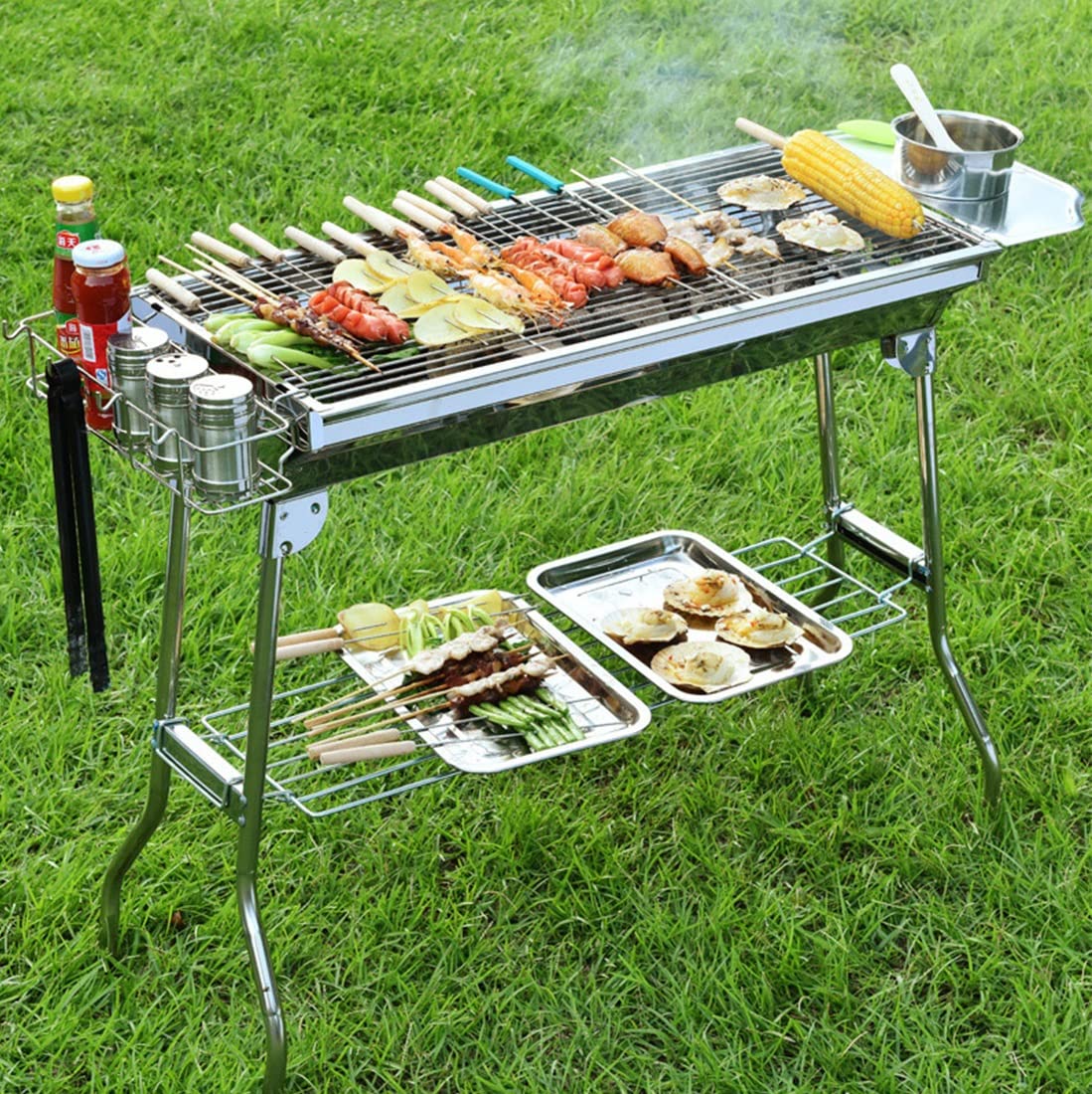 JIUYUEYA Parrilla de Barbacoa de carbón portátil con cestas de condimentos y Ganchos, Cocina de Acero Inoxidable for Camping, Picnic, Senderismo, Fiesta en el jardín, Festival