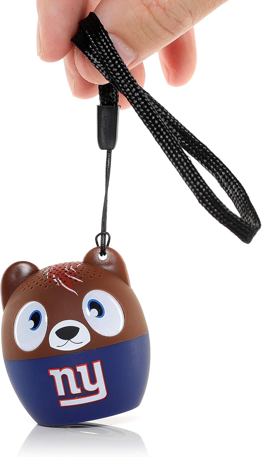 Hand holding the Bitty Boomers speaker by its attached strap.