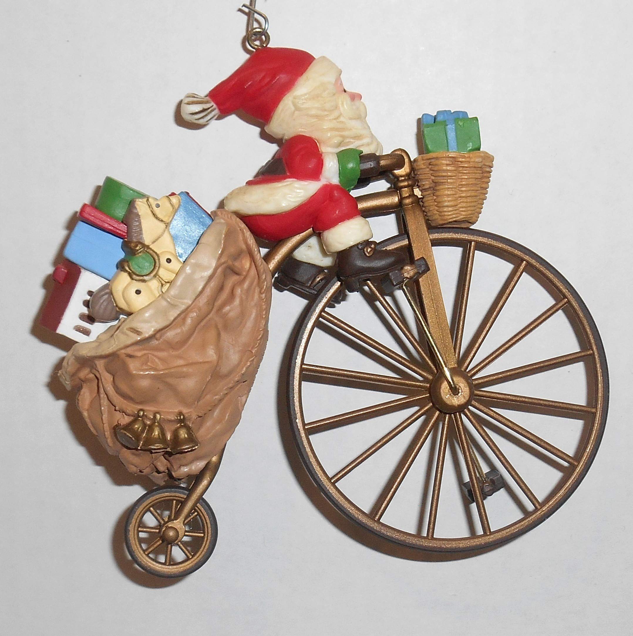 1982 Hallmark Cycling Santa Ornament