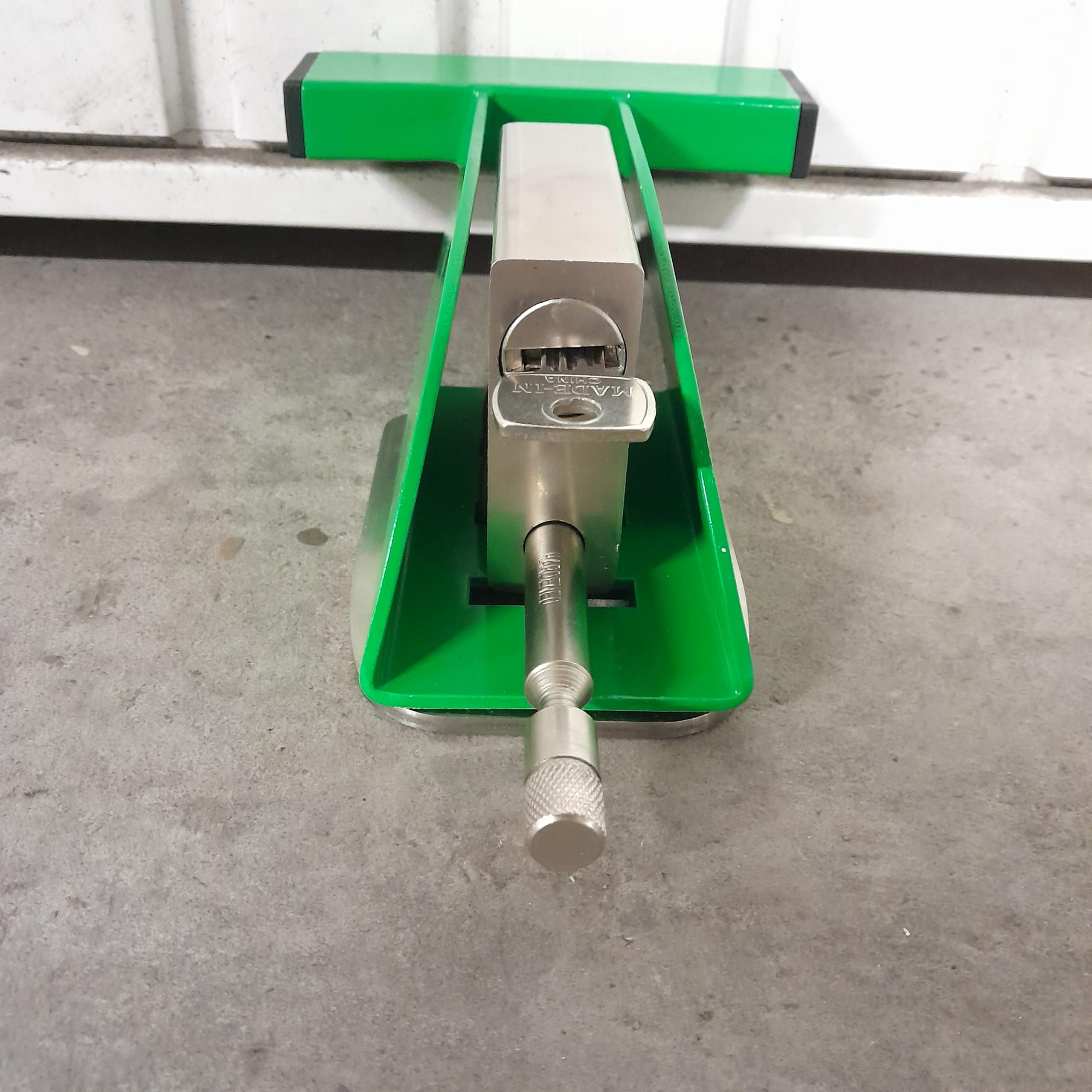 Verrou de porte de garage sécurisé par un cadenas de haute protection