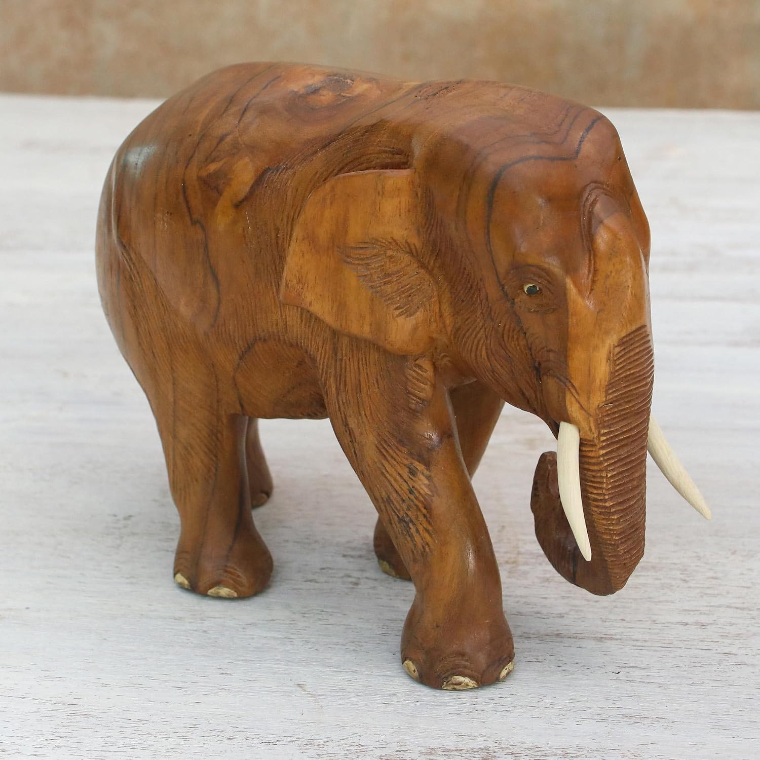 NOVICA Artisan Handmade Teak Wood Sculpture of Rightfacing Elephant from Thailand Brown Woodteakwood Animal Themed [6.75in H x 4.3in W x 7.75in D] ' Go for A Walk' Right