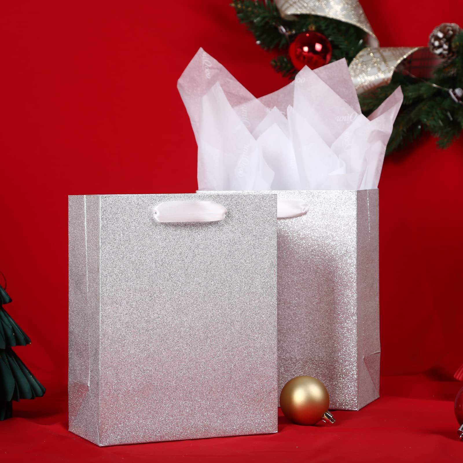 UNIQOOO 12Pcs Embossed Silver Glitter Christmas Gift Bags with 24 Tissue Paper Bulk, M 9x7 Inch, Xmas Silver Gift Wrap Bags, Wedding Bridal Baby Shower Favor Bag Gift Packaging, Birthday Holiday Party